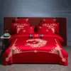 Nuevo conjunto de boda de cuatro piezas 100% algodón bordado 2026, con un diseño lujoso y elegante de algodón de fibra larga, en estilo chino tradicional y color rojo vibrante para bodas