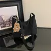 Bolsa feminina de grande capacidade 2026 novo estilo nicho versátil para o dia a dia bolsa tote super moderna casual de ombro transversal