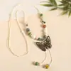 Collar con colgante de campana de mariposa de cerámica de estilo étnico retro para mujer, diseño nuevo y moderno, cadena larga para suéter, accesorios