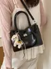 Bolso de mano vintage de nicho estilo coreano, nuevo modelo verano 2026, gran capacidad, simple, adecuado para ir al trabajo, bolso tipo cubo de un solo hombro cruzado
