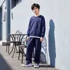 Traje para Niños Estilo Primavera y Otoño 2026 Nuevo Estilo Ropa de Otoño para Niños Medianos y Grandes Sudadera de Cuello Redondo Ropa Falsa de Dos Piezas para Niños Venta al por Mayor