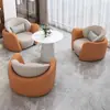 Conjunto minimalista y lujoso de sofá individual y mesa de centro, adecuado para uso casual en hoteles, salones de belleza, áreas de recepción y centros de exposiciones; también incluye un juego de mesas y sillas para reuniones y discusiones