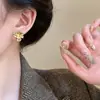 Pendientes de flor de ojo de gato de metal estilo francés para mujer, ligeros, lujosos, vintage, exquisitos, con diseño de nicho para otoño e invierno.