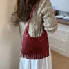 Bolso de Axila Estilo Denim de Nicho para Mujer Otoño 2025 Nuevo Bolso de Hombro Cruzado Bolso con Borlas Retro Bohemio
