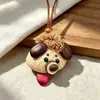 Encantador llavero de cachorro sacando la lengua, colgante de dibujos animados naturales, semillas de terapia de sonido curativo, popular en zonas escénicas, llavero divertido y lindo