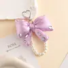 Nuevo Collar de Perlas Lazo Diamante Brillante Tridimensional Relleno Colorido Colgante para Teléfono Móvil Bolso de Nicho Colgante para Llaves