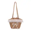 Bolso de paja de diseño único para mujer, gran capacidad, nuevo modelo 2026, lindo bolso de hombro, bolso tipo cubo de playa estilo vacación en la playa