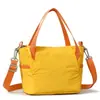 Al por mayor 2026 Nuevo Estilo Contraste de Colores Frescos Tela de Nylon Bolso de Mano Cuadrado Pequeño Bolso de Hombro de Moda para Mujer Bolso Cruzado Casual