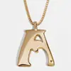 Europa y Estados Unidos gran INS metal viento 26 capital letra inglesa colgante collar largo para hombres y mujeres