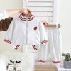 Traje para bebé niño y niña 2025 nuevo primavera bebé camisa con cremallera de dos piezas primavera y otoño nuevo niños una generación de cabello