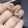 Pendientes Europeos y Americanos de Alta Gama Transfronterizos de Tres Colores y Tres Anillos para Mujer, Pendientes Versátiles de Oro Rosa, Mismo Estilo que en Xiaohongshu