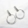 Pendientes huecos de taladro completo con diseño de personalidad de círculo geométrico exagerado de metal europeo y americano, venta al por mayor de pendientes
