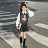 Estilo Academia Feminino Desenho Animado Pequeno Jade JK Conjunto de Três Peças Primavera e Outono Novo Estilo 2026 Colete de Tricô Camisa Saia Plissada Conjunto
