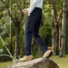 Calças de negócios casuais versáteis populares de outono e inverno com elasticidade, calças softshell para atividades ao ar livre, calças retas masculinas de fleece fino composto