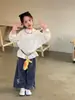 Camiseta Infantil 2026 Otoño Estilo Coreano Niños Color Sólido Versátil Manga Larga Unisex Cuello Redondo Suéter Superior Moderno