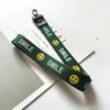 Acessórios para Capinha de Celular com Letra e Rosto Sorridente Mais Vendidos, Cordão, Alça de Pescoço, Capinha de Celular Feminina da Moda, Pingente para Bolsa