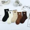 Calcetines dobles para niños otoño e invierno nuevos calcetines de media pantorrilla de marca de moda coreana engrosados de algodón peinado calcetines marrones para niños calcetines sin hueso