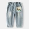Jeans para niño 2025 Nuevo Primavera y Otoño Pantalones de Pierna Recta Estampado de Bolsillo de Dibujos Animados a la Moda Pantalones Largos para Niños Mayores