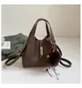 Bolso Cubo Texturizado de Mano de Alta Gama para Mujer, Nuevo Estilo Coreano Invierno 2025 Versátil Bolso Cruzado de Hombro Casual