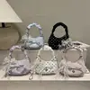 Nuevo bolso de mano para mujer 2026 con textura minimalista, bolso de lunares en forma de media luna moderno y casual, bolso de hombro cruzado tendencia de primavera