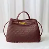 Bolso tote de diseño de nicho de moda, nudo metálico, tejido de cuero, hombro, portátil, gran capacidad, piel de vaca, bolso para mujer