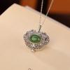 Colgante de bolsita hueca Xiangyun de plata esterlina S925 bañada en oro con jaspe Hetian de moda nacional