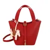 Bolso de Mano Pequeño con Patrón de Lichi Transfronterizo Primavera 2026 Nuevo de Moda Casual Cubo Versátil Bolso de Hombro Cruzado