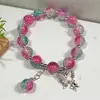 Pulseira de Vidro Flor Explosão Sonhadora 10mm Transfronteiriça para Mulheres com Pingente de Borboleta em Cor Degradê, Pulseira de Amizade com Design Único