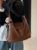 Bolso tote 2026 otoño nuevo modelo mochila de gran capacidad para el trabajo diseño de nicho bolso de hombro para mujer bolso cruzado multiusos