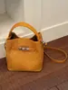 Bolsas pequeñas súper populares para primavera y verano para mujer 2026 nueva moda bolso cruzado versátil bolso de mano para el trabajo bolso tipo cubo bolso tote pequeño