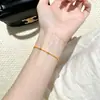 Pulsera de cobre chapada en oro para mujer, alta retención de color, exquisita joyería de cadena de cuentas, accesorios de comercio exterior europeos y americanos, pulsera que no se decolora