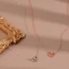Moda simple pequeño fresco hueco colgante de amor collar para mujer versátil ins cadena de clavícula en forma de corazón alta calidad al por mayor