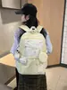 2026 Nova Mochila Estilosa Versão Coreana Grande Capacidade Versátil Bolsa Escolar para Alunos do Ensino Fundamental II e Médio Mochila Leve de Duas Alças