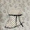 Top sin mangas de estilo vintage francés con estampado de lunares, estilo puro deseo de verano, con lazo para ceñir la cintura, dobladillo irregular, top ajustado y que favorece la figura
