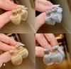 Pendientes transfronterizos de Amazon Pendientes de amor huecos de alto diseño Malla de alambre esférica Pendientes rojos para mujer al por mayor