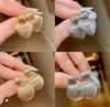 Pendientes transfronterizos de Amazon pendientes de corazón hueco de alta gama pendientes anillo en forma de red cepillada pendientes de celebridad para mujer al por mayor