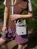 Bolsa de Viaje Casual Cruzada al Hombro para Teléfono Móvil y Botella de Agua, Moda Versátil, Nuevo Estilo Coreano Verano 2026