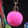 Al por mayor en stock Bola de pelo de imitación de conejo Rex de 8 cm llavero colgante lindo para mujer bolso de coche teléfono móvil colgante de felpa