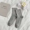 Outono e inverno novo cor sólida pequeno bordado de amor meias de cano básicas estilo acadêmico meias infantis versáteis estilo acadêmico meias femininas