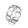 Venta caliente transfronteriza Anillo de acero de titanio de diseño creativo redondo Tiantian para mujer que no se desvanece nicho hueco anillo liso fabricante de anillos