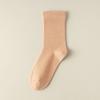 Otoño e Invierno nuevos calcetines para mujer dopamina color sólido sin costuras media pantorrilla holgados calcetines de confinamiento algodón estilo japonés calcetines para mujer al por mayor
