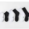 Meias Esportivas Masculinas Lisas 2025 Atacado Meias Masculinas de Cano Médio Outono e Inverno Absorventes de Suor Meias de Basquete Masculinas Antiderrapantes
