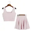 Nuevo conjunto de punto liso de verano para mujer, chaleco corto sin mangas de cuello cuadrado con borde ondulado y conjunto de dos piezas de falda midi de cintura alta