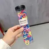 Cintas para el pelo del tamaño de un pulgar para niños en lata que no dañan el cabello, Gomas de pelo de colores, Cuerdas para coleta de alta gama estilo coreano, Estuches de cuero
