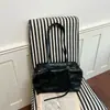 A nova bolsa tote de grande capacidade de Shuai Mi, uma bolsa de ombro casual e estilosa, uma bolsa de axila moderna e fashion