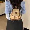 Mochila para mujer de uso diario 2026 linda nueva de dibujos animados invierno de un solo hombro estampado de leopardo estilo coreano y japonés gamuza bandolera bolso de mano de doble hombro