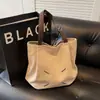 Bolso de hombro para mujer con diseño de nicho, estilo ins, sensación de alta gama, bolso de lona de gran capacidad, bolso de mano versátil estilo coreano para estudiantes