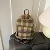 Mochila Mini Multifuncional de Moda Estilo Coreano para Otoño e Invierno para Mujeres 2026 Nueva Mochila de Cuadros de Nicho Bolso Pequeño