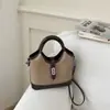 Bolso Tote Pequeño Super Caliente Esenciales de Oficina para Mujer 2026 Nuevo de Moda Popular de Verano Bolso Cubo Cruzado de un Solo Hombro