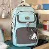Bolsa de monedas de oso de color block de gran capacidad, elegante y simple, mochila escolar 25 modelo nuevo para niñas de secundaria y preparatoria